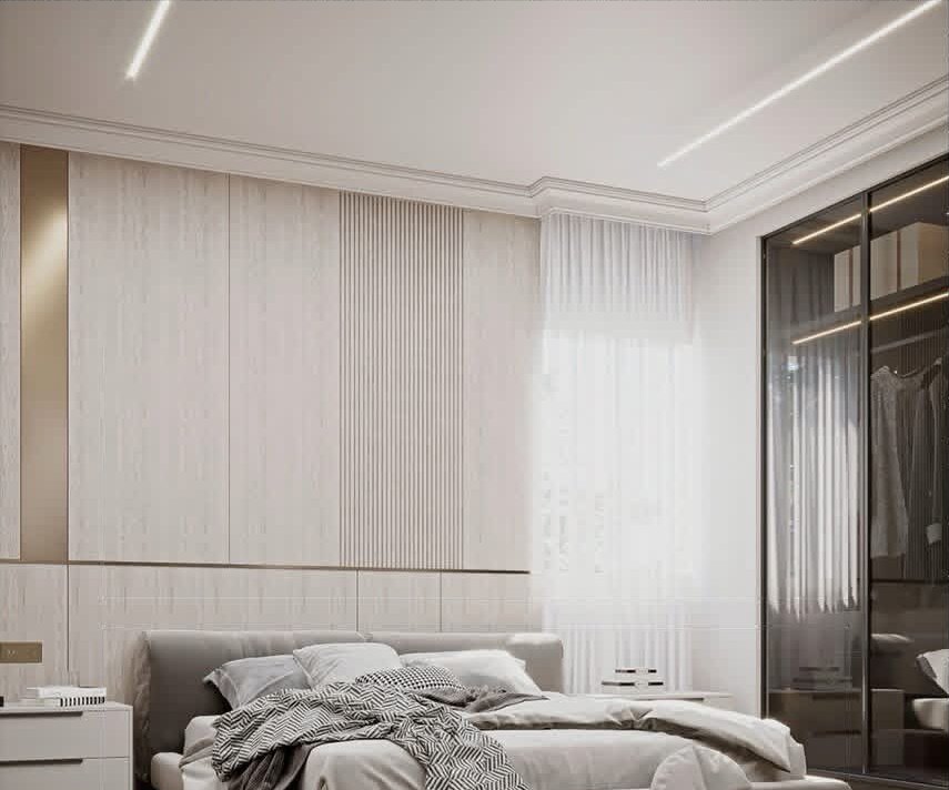 Master bedroom with fluted wall panels and glass wardrobe
