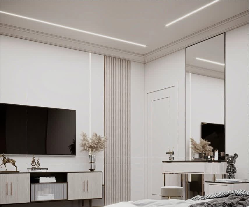 Bedroom media wall with vanity and mirror