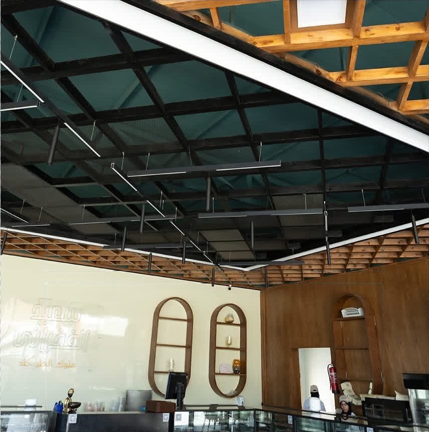 Steel and timber lattice ceiling with linear lights