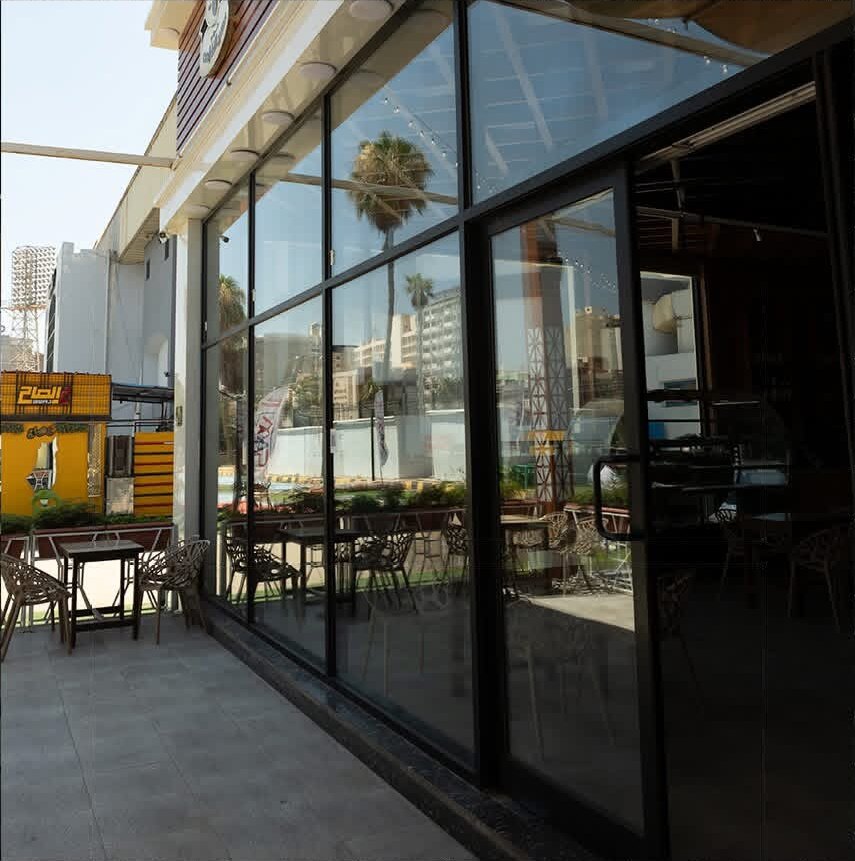 Full‑height glass frontage opening to the terrace