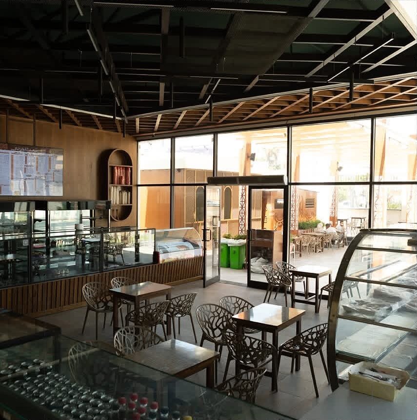 Café seating area with glazed walls and timber ceiling